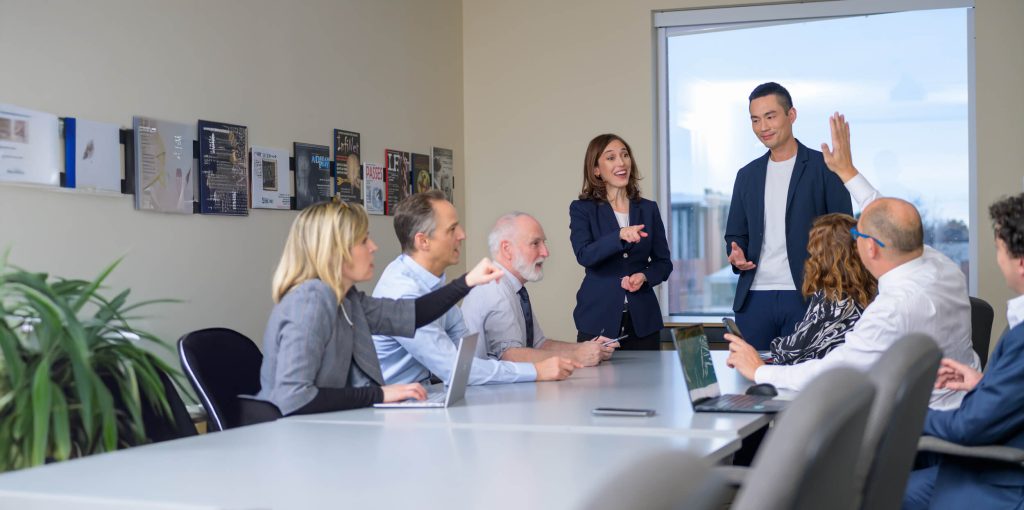 Group of People at a Boardroom table representing Executive Presence