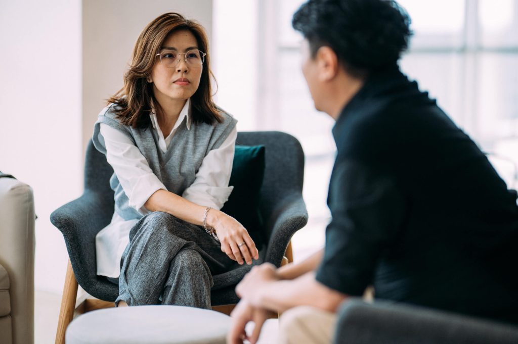 A woman and a man in a coaching session